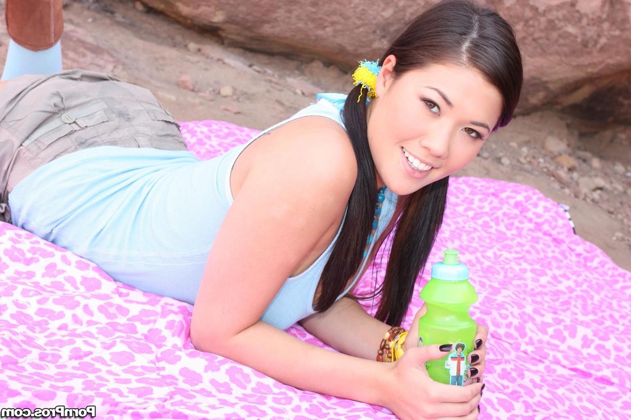 20P Pigtailed Asian hottie London Keyes suns big natural tits & flashes panties