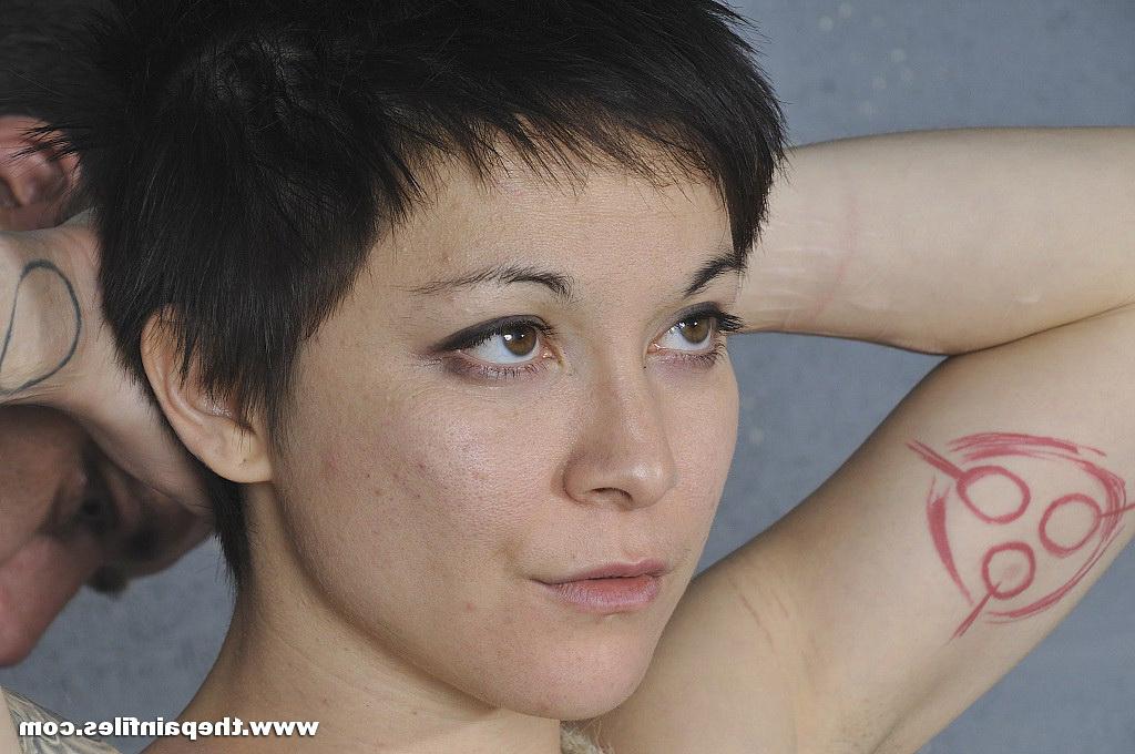 16P Short haired female is suspended upside down by ropes while naked