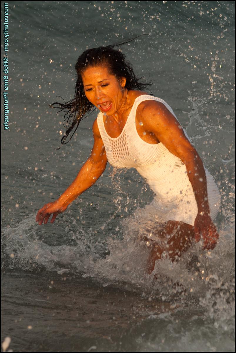 15P Asian bodybuilder Diane Nguyen poses in swimwear while at the ocean