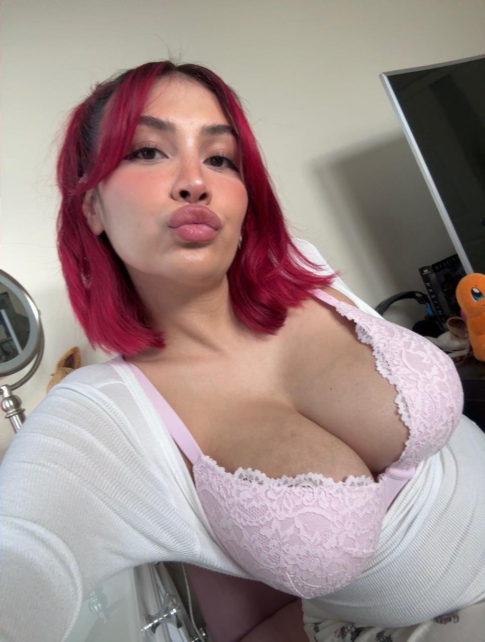 11P Buxom redhead Angel displays her big boobs up close in a sexy compilation