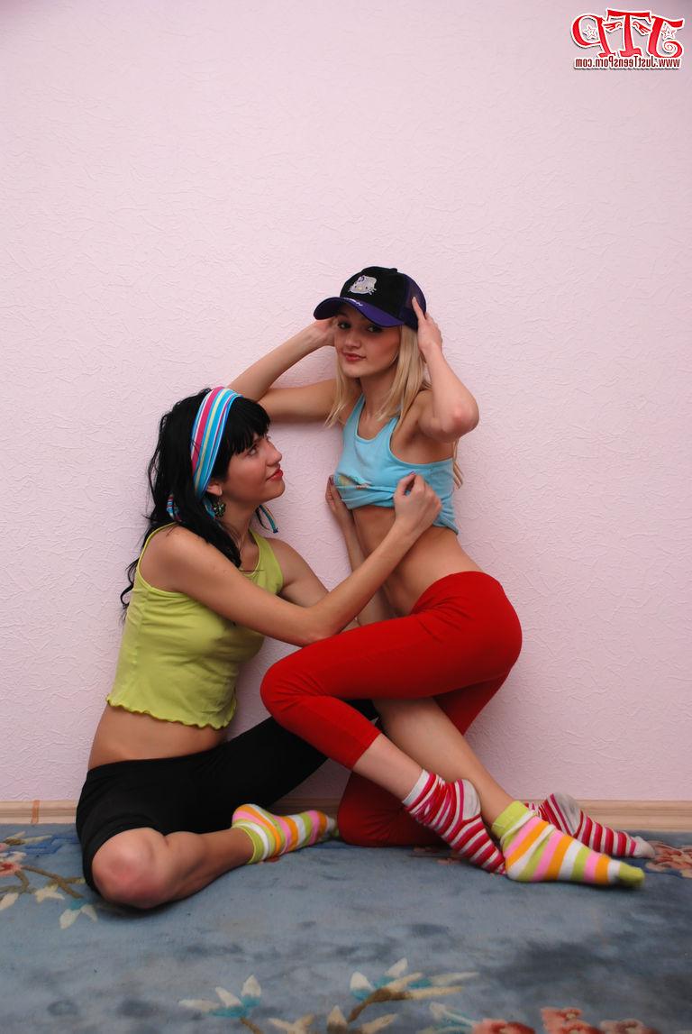 20P Young lesbians hump each other while stripping to their socks