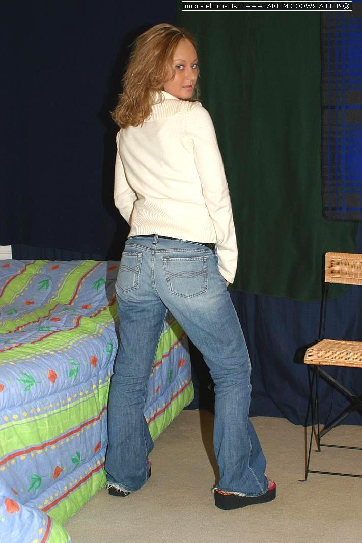 16P Blond amateur Danny undresses before showing her landing strip pussy on a bed