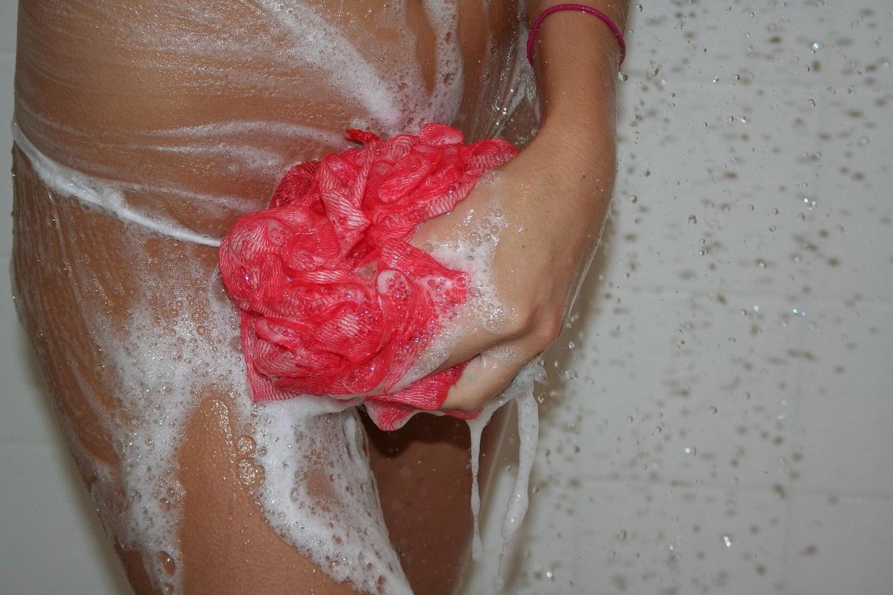 20P Stunning teen Katie soaps and washes her big fake tits in the shower