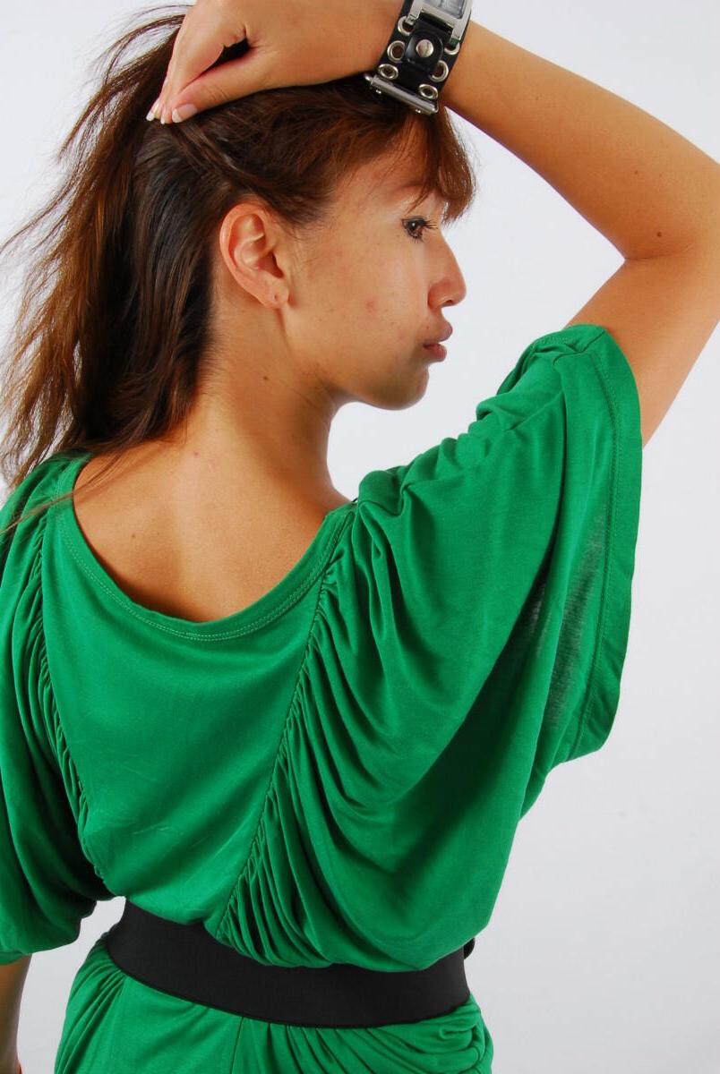 16P Redheaded Asian girl Evita models a Guess style cuff watch during SFW action