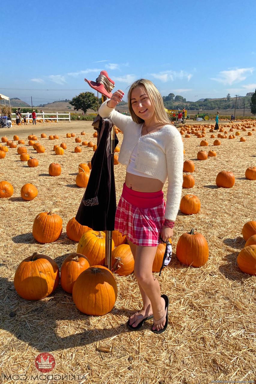 20P Tiny blonde Lily Adams spreads on a patio swing & shows her holes up close