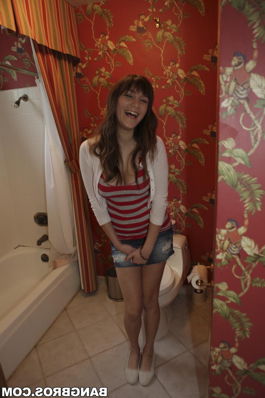 17P Curvy brunette babe Holly Michaels showing her big natural tits in a bathroom