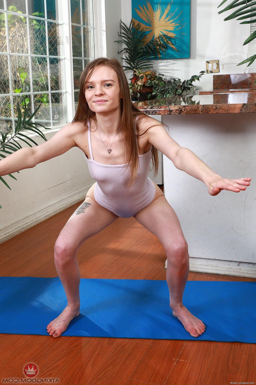 20P Little acrobatic babe Jessae Rosae strips on a yoga mat & flaunts her holes
