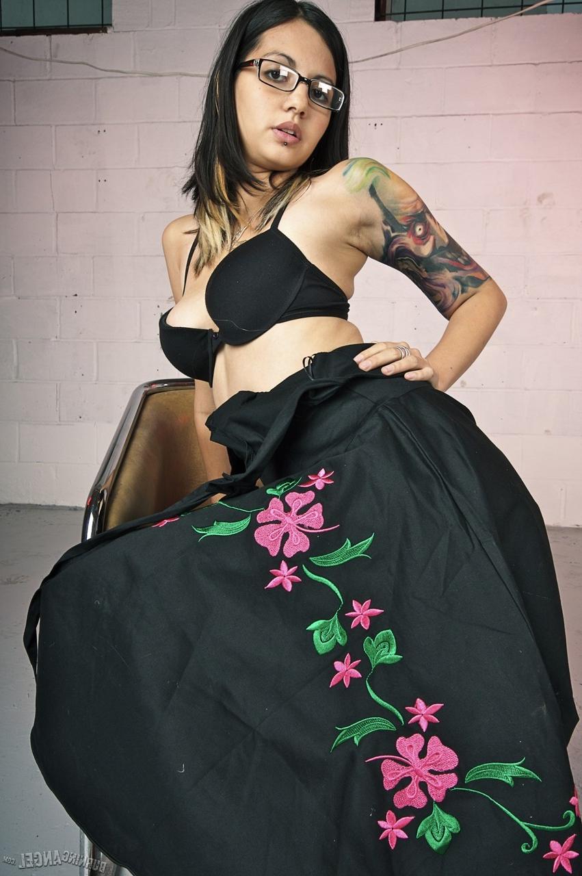 17P Glasses clad Holly D with big tits drops dress & sheer panties to pose naked