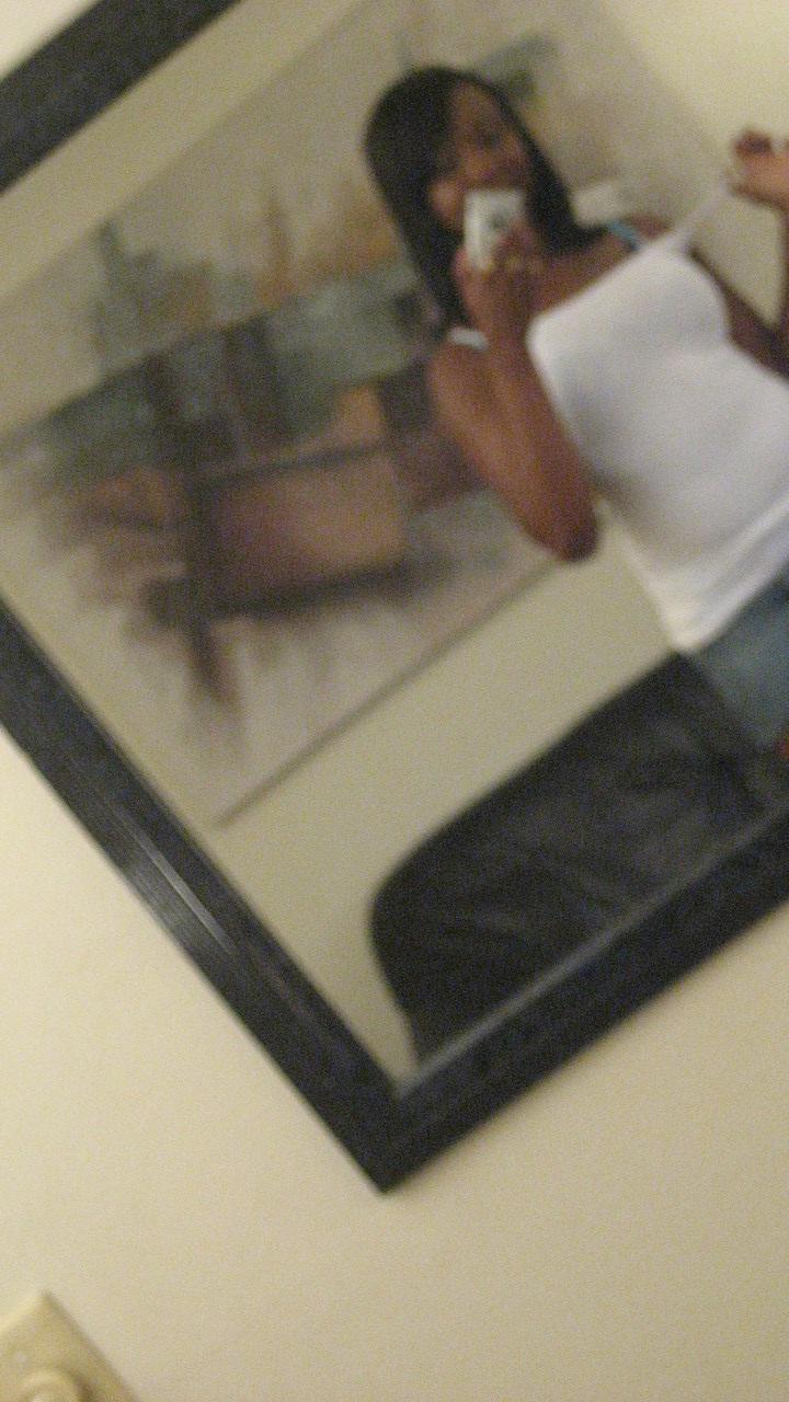20P Ebony hottie Elisha Turner strips and shows her natural boobs in the mirror