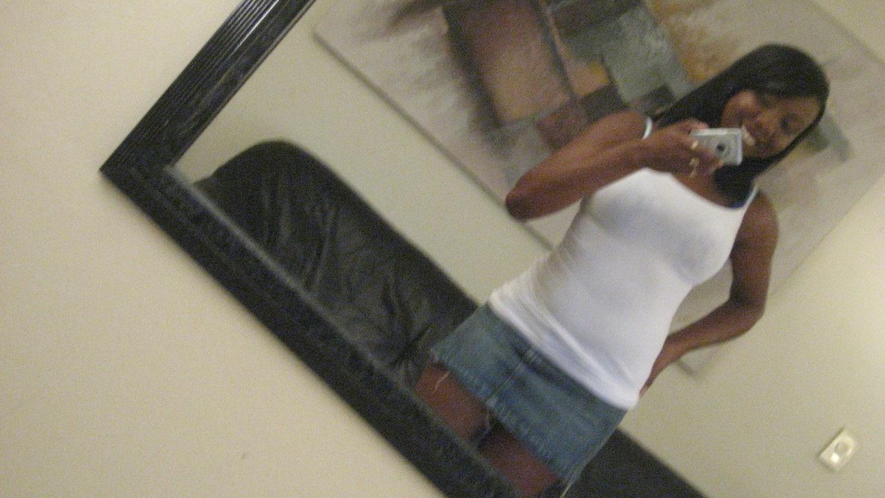 20P Ebony hottie Elisha Turner strips and shows her natural boobs in the mirror