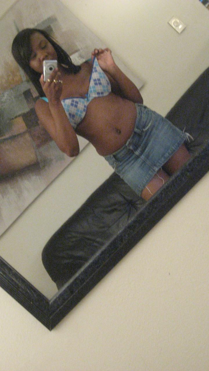 20P Ebony hottie Elisha Turner strips and shows her natural boobs in the mirror