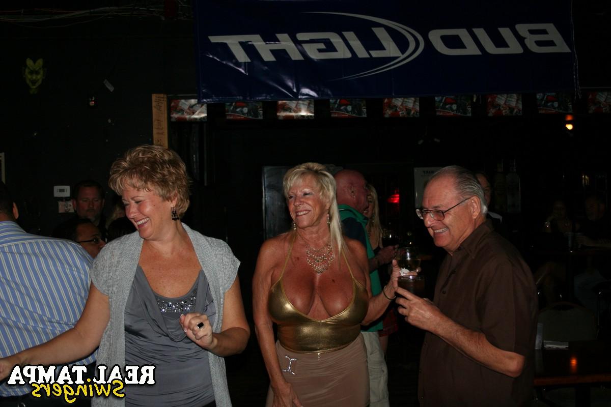 20P Curvaceous blonde MILFs with big tits share black cocks at a party
