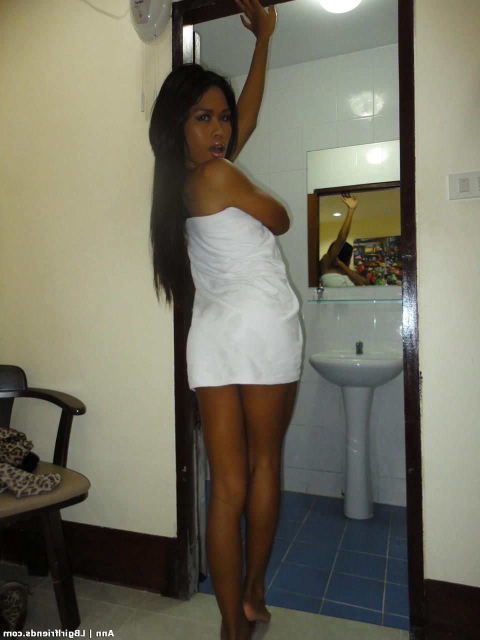 17P Tanned ladyboy Ann loses towel showing natural tits & flashing tiny dick