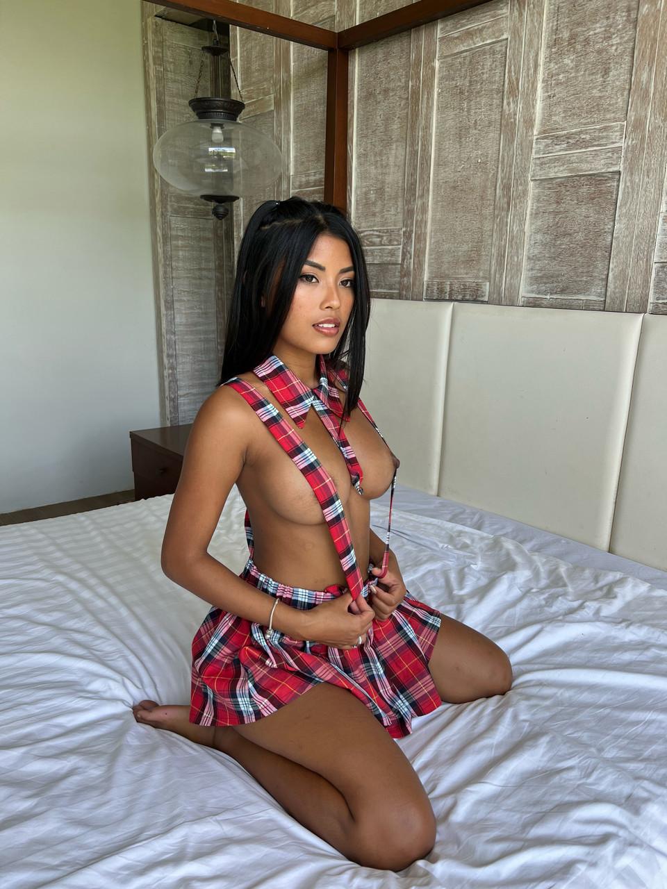20P Sexy OnlyFans cam model Tita Sahara shows off her big tits on her bed