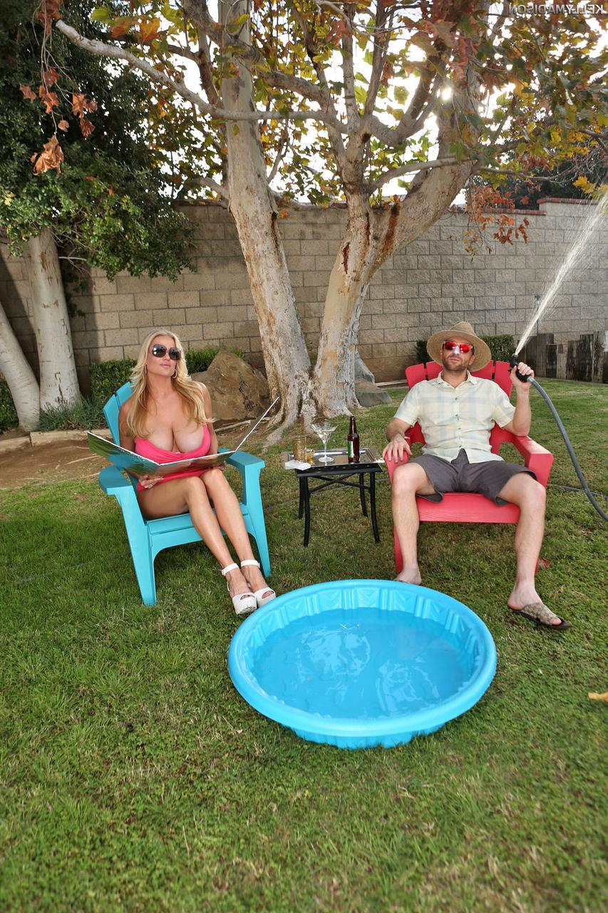 17P Gorgeous blonde MILF Kelly Madison displays her huge boobs outdoors