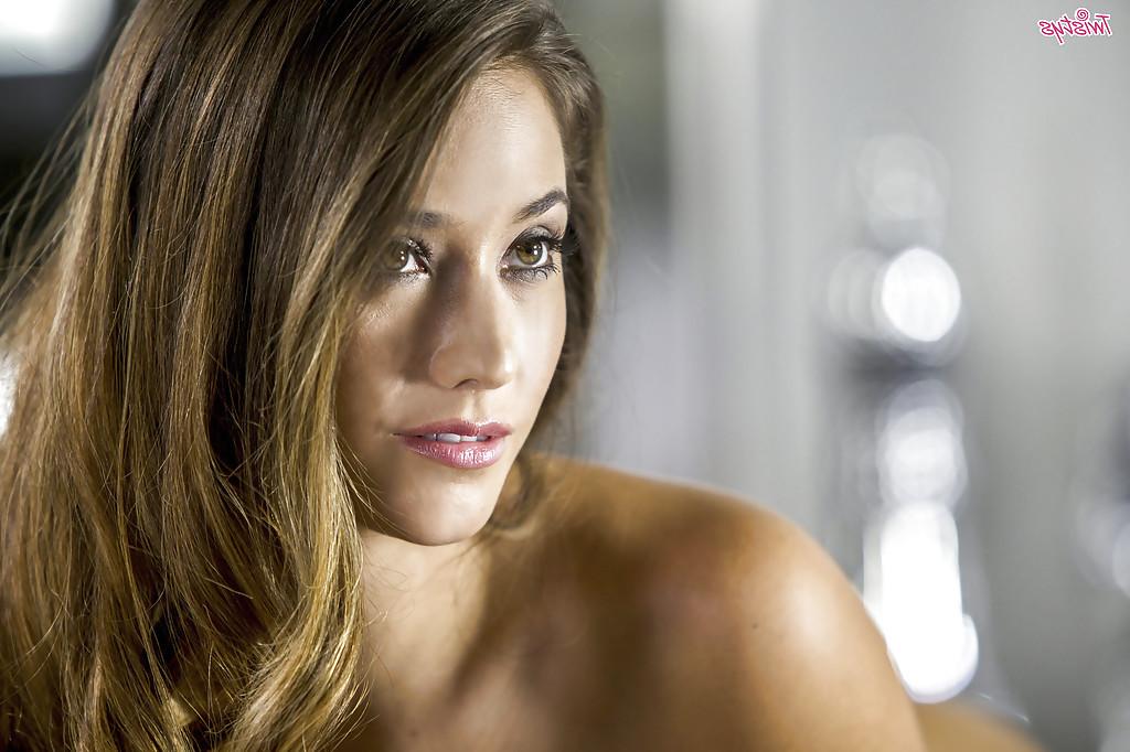 16P Pornstar Eva Lovia posing solo in sexy black nylons and lingerie