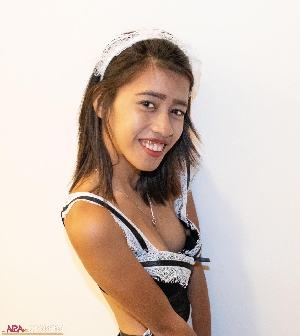 10P Tiny Asian maid Danica posing in her uniform and unveiling her boobs