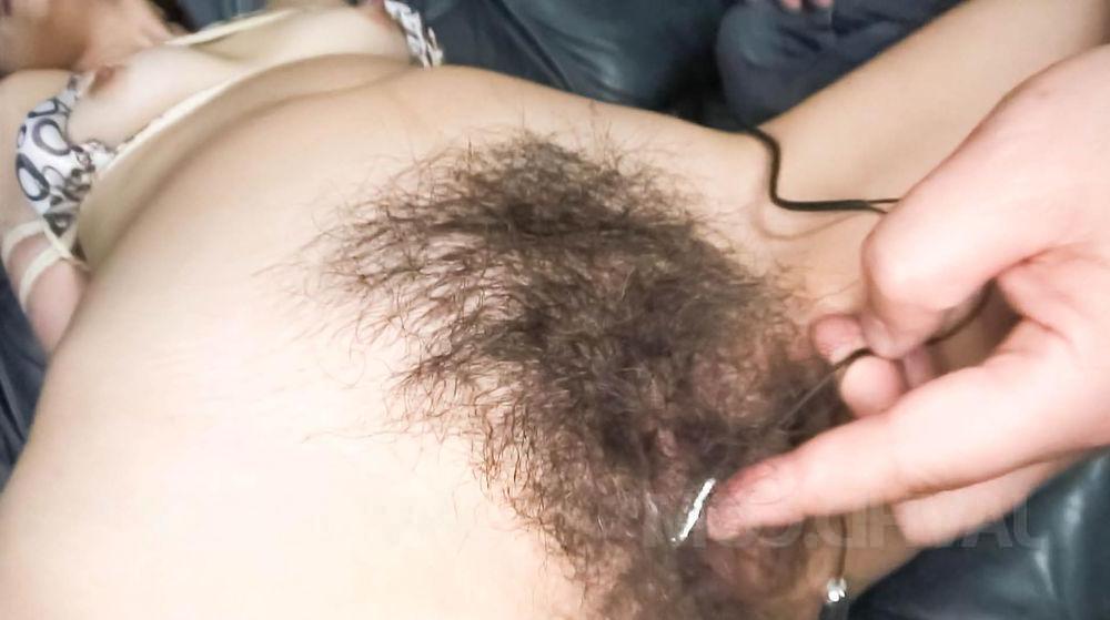 15P Japanese MILF Kaoru Natsuki has her full bush masturbated on a sofa