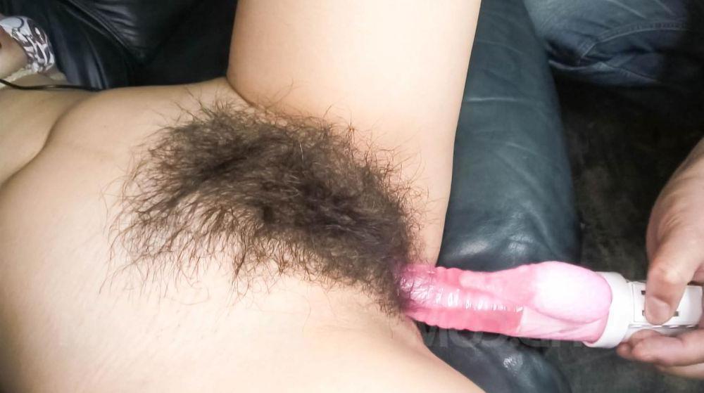 15P Japanese MILF Kaoru Natsuki has her full bush masturbated on a sofa