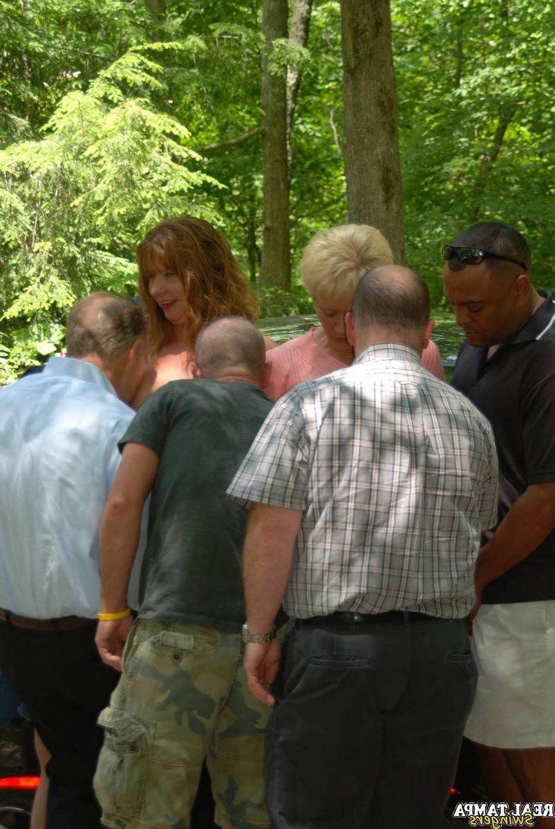 20P Insatiable swinger wives get stripped and fucked in an outdoor gangbang