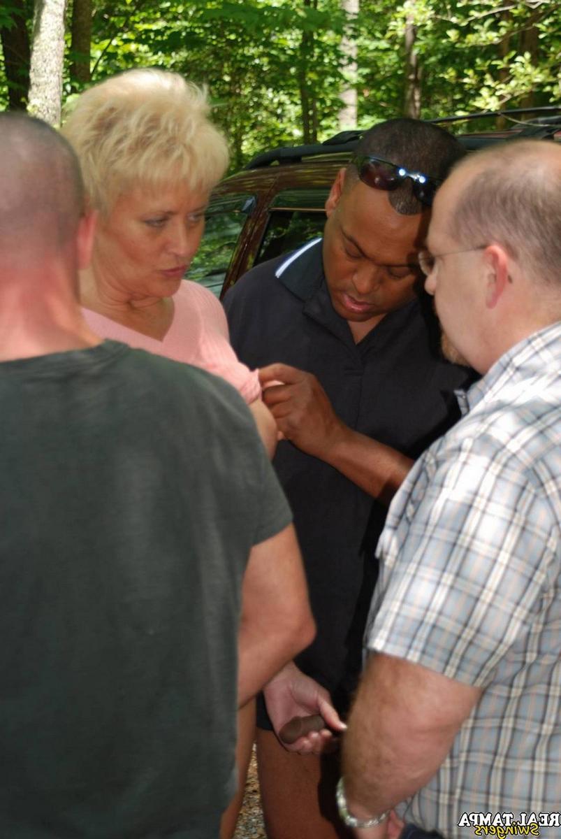 20P Insatiable swinger wives get stripped and fucked in an outdoor gangbang