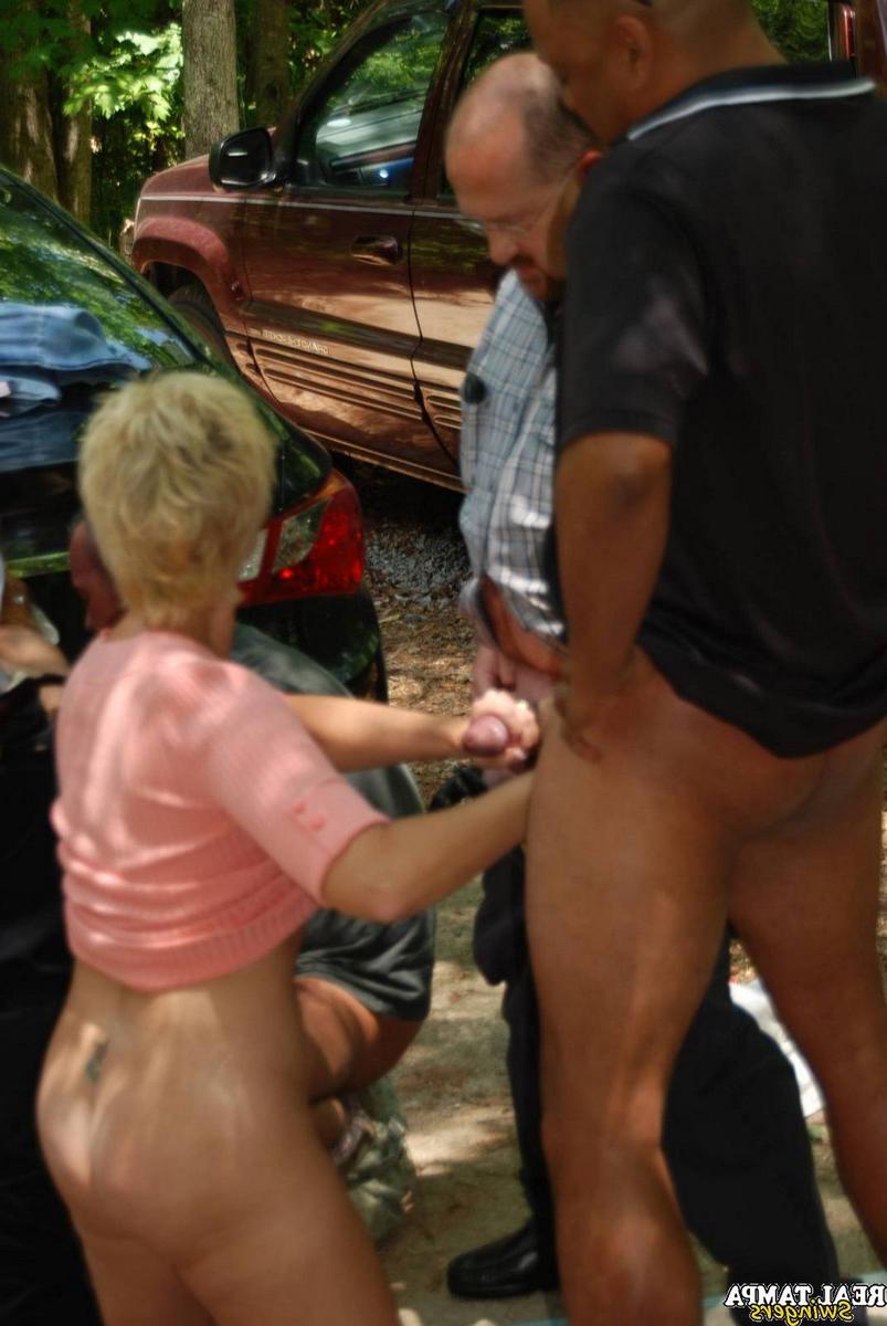 20P Insatiable swinger wives get stripped and fucked in an outdoor gangbang