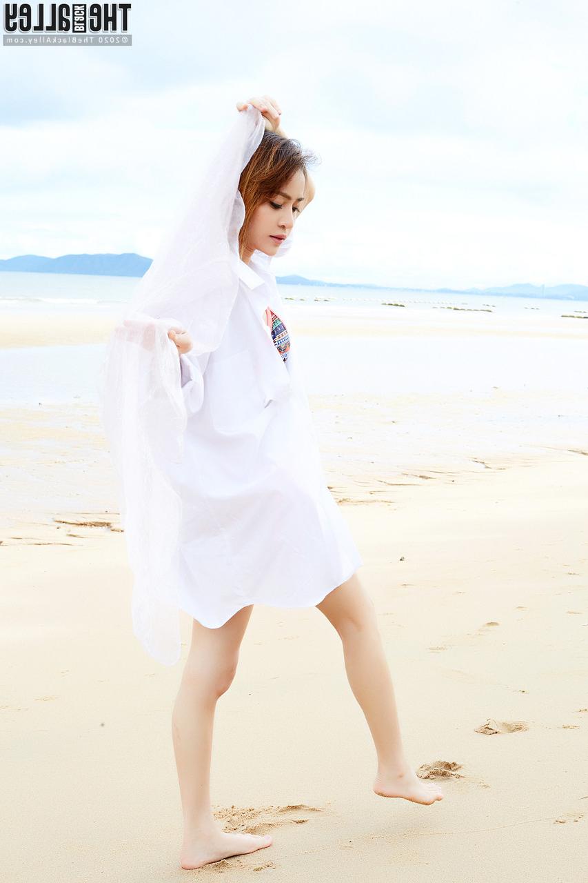 16P Redheaded Asian girl Eileen models a bikini at the beach before getting naked