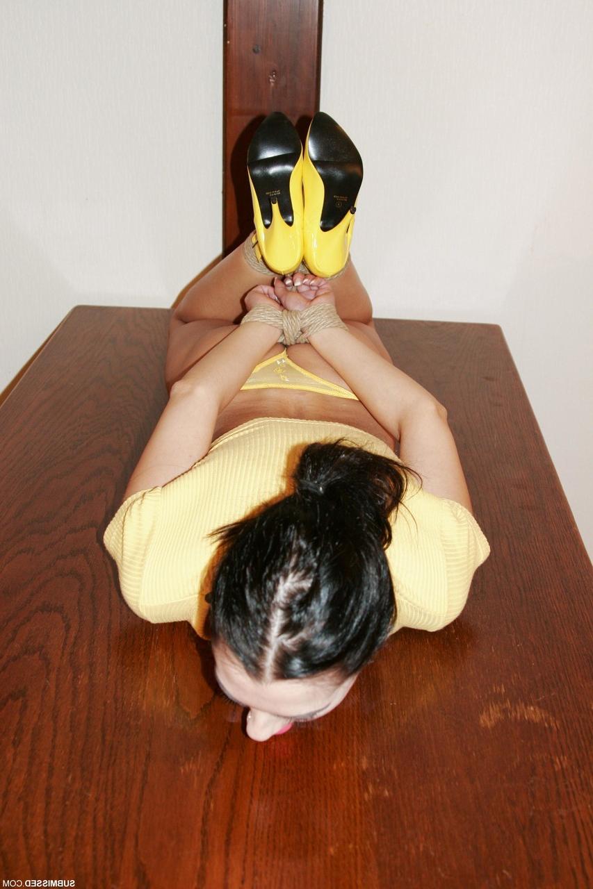 20P Brunette with a pontytail Leyla poses bound in her yellow shirt & panties