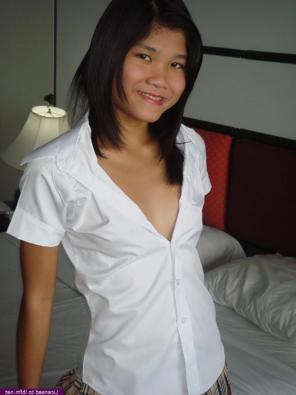 12P Young Asian girl dons mesh mesh stockings before removing cotton underwear