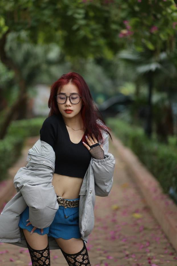 20P Nerdy Asian babe Natalia posing in her slutty outfit in the garden