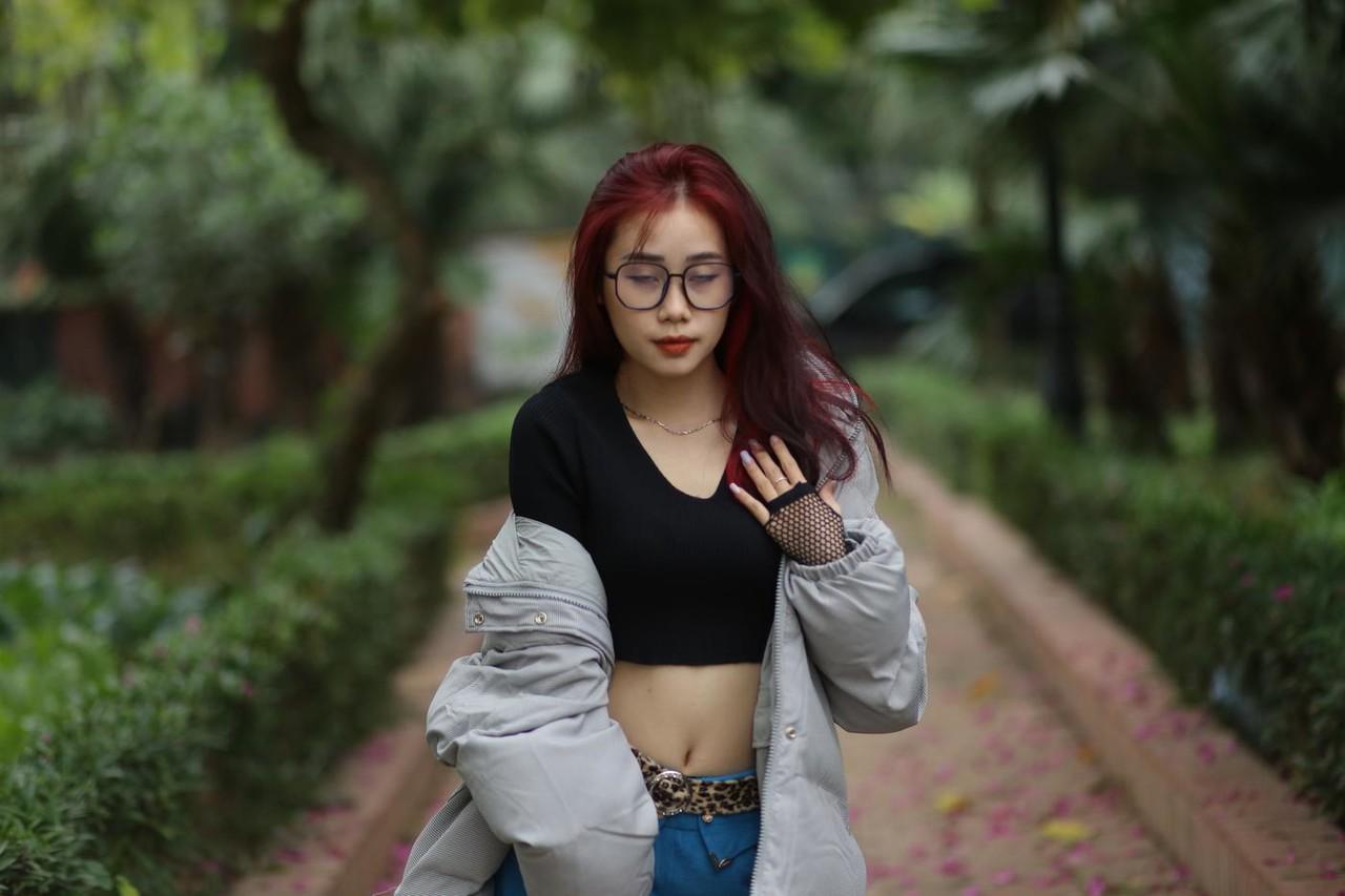 20P Nerdy Asian babe Natalia posing in her slutty outfit in the garden