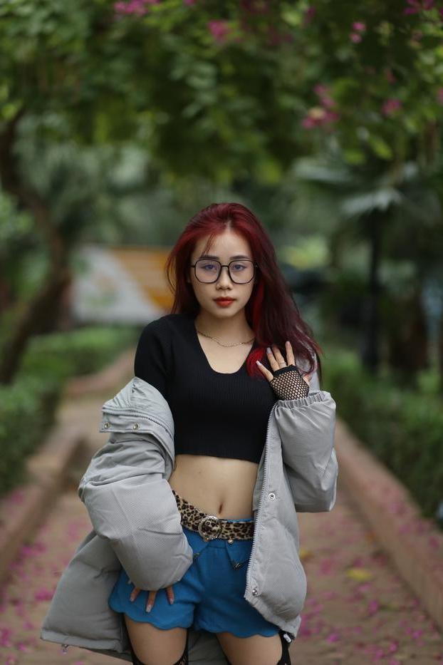 20P Nerdy Asian babe Natalia posing in her slutty outfit in the garden