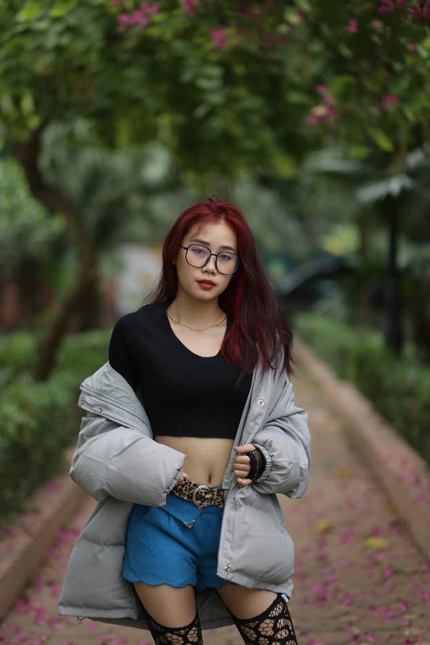 20P Nerdy Asian babe Natalia posing in her slutty outfit in the garden