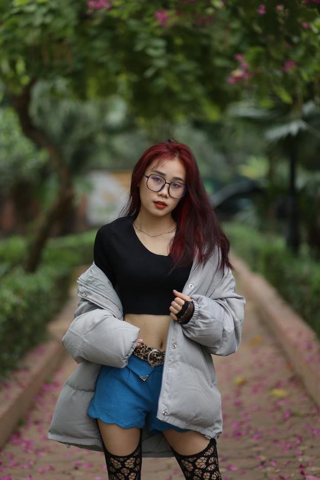 20P Nerdy Asian babe Natalia posing in her slutty outfit in the garden