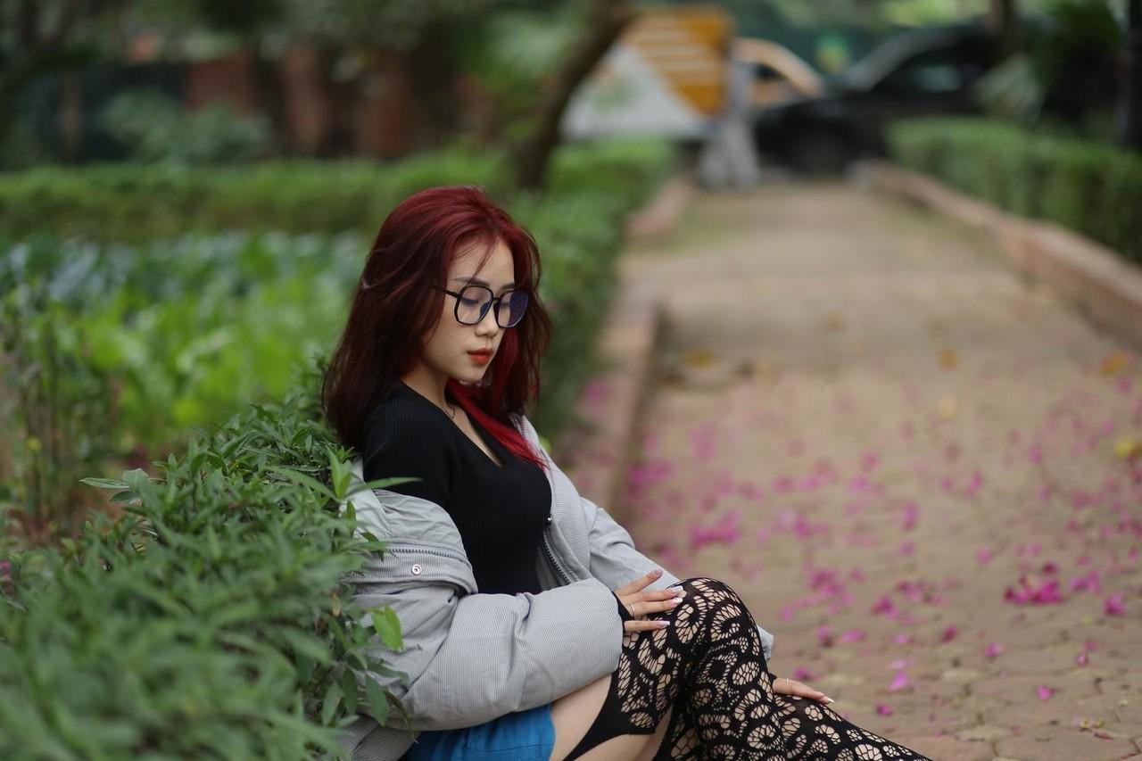 20P Nerdy Asian babe Natalia posing in her slutty outfit in the garden