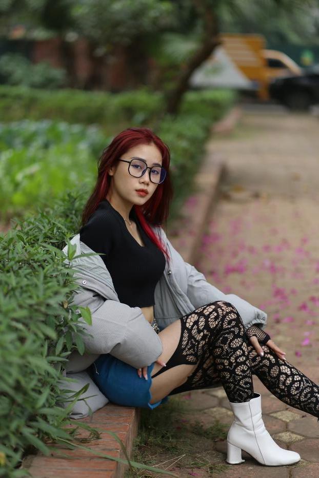 20P Nerdy Asian babe Natalia posing in her slutty outfit in the garden