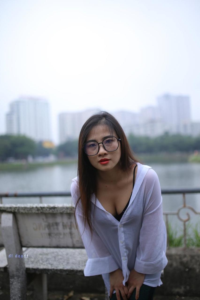 20P Pretty Asian babe Elena posing in her white shirt and pants outdoors