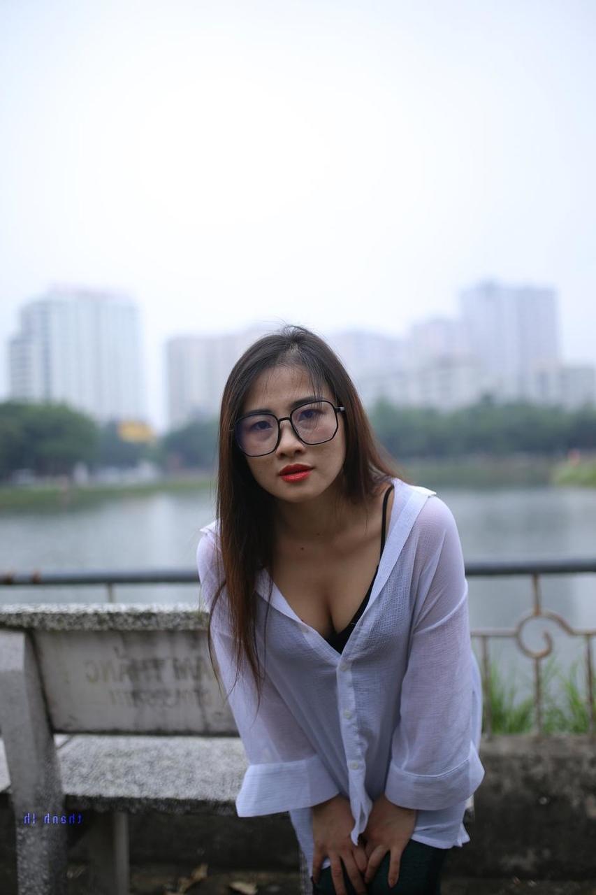 20P Pretty Asian babe Elena posing in her white shirt and pants outdoors