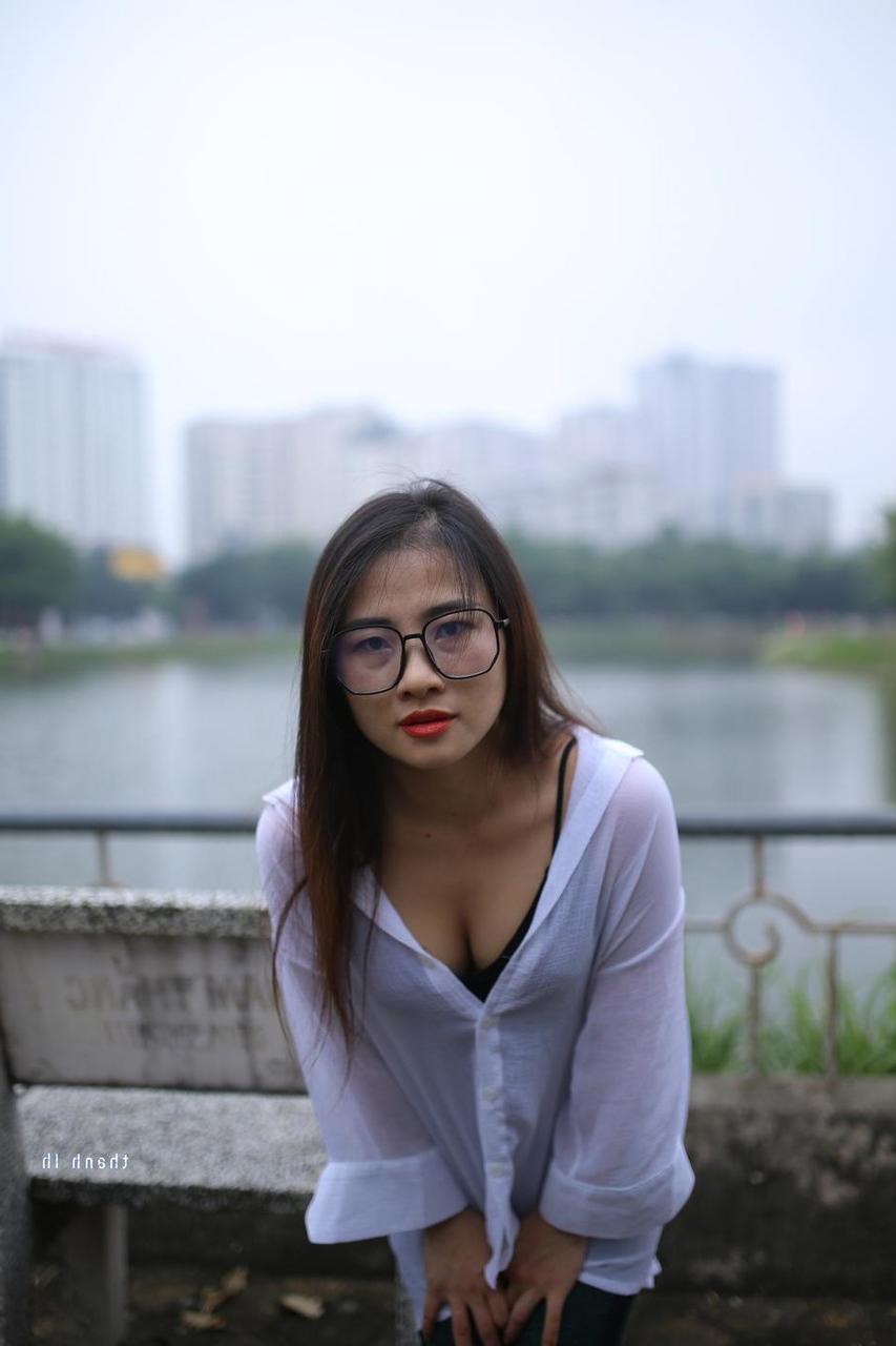 20P Pretty Asian babe Elena posing in her white shirt and pants outdoors
