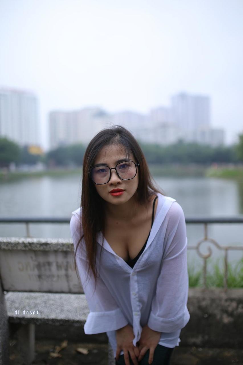 20P Pretty Asian babe Elena posing in her white shirt and pants outdoors