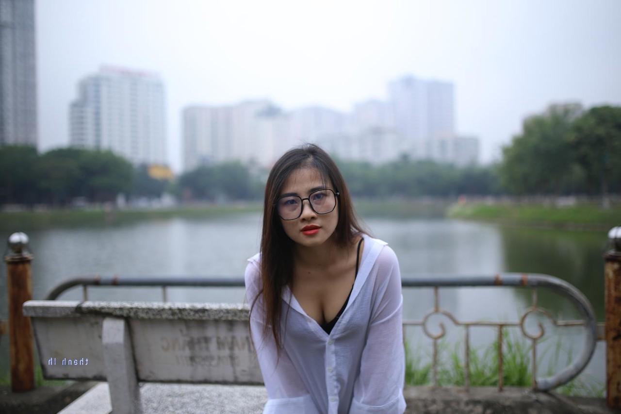 20P Pretty Asian babe Elena posing in her white shirt and pants outdoors