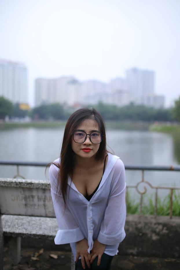 20P Pretty Asian babe Elena posing in her white shirt and pants outdoors