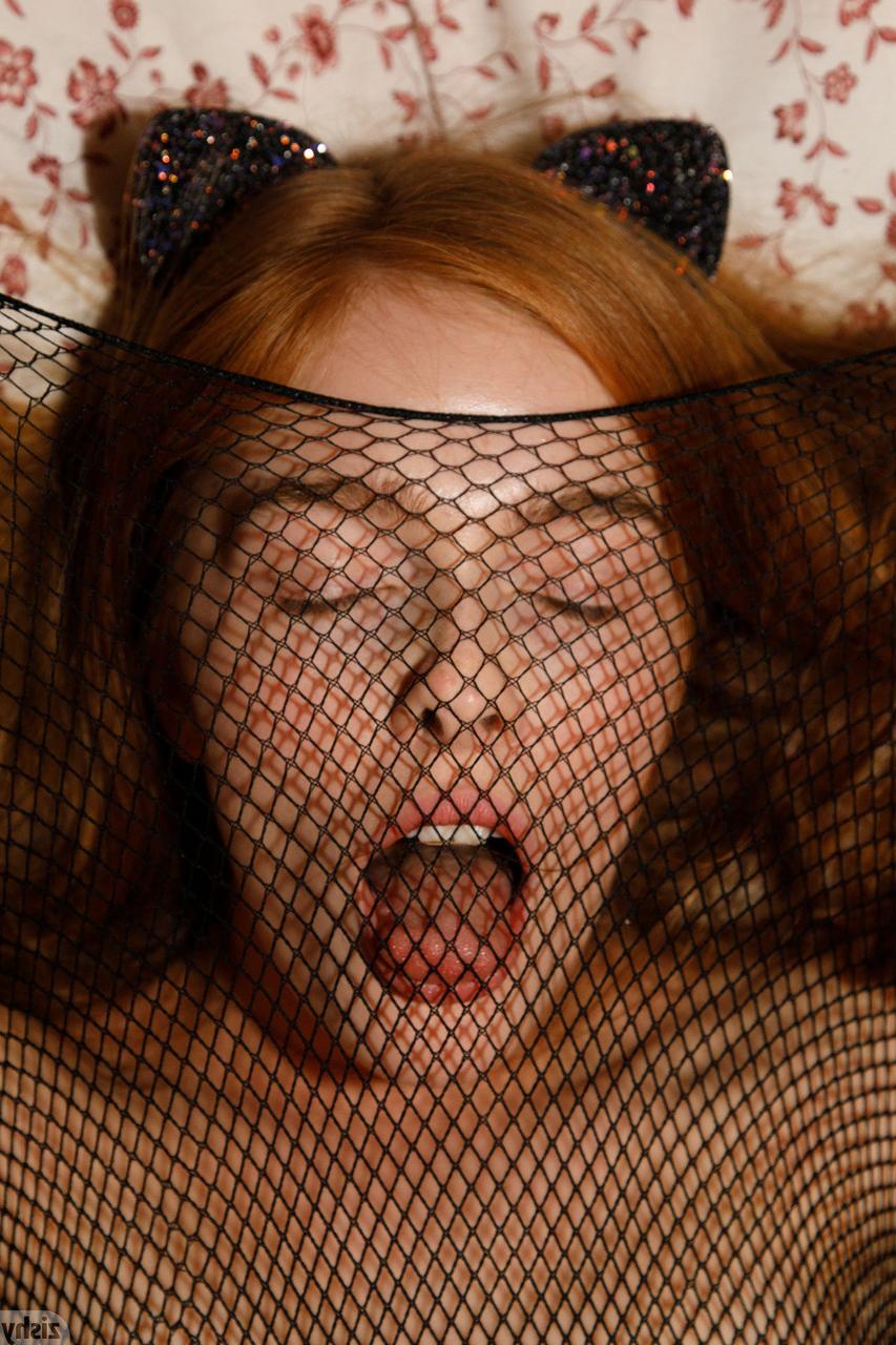 12P Redheaded Russian Jia Lissa puts her sexy bodystocking on and poses