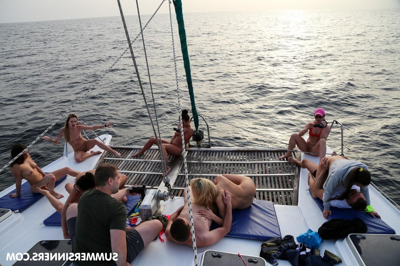 20P Slutty babes fuck multiple men and have lesbian sex outdoors on a boat