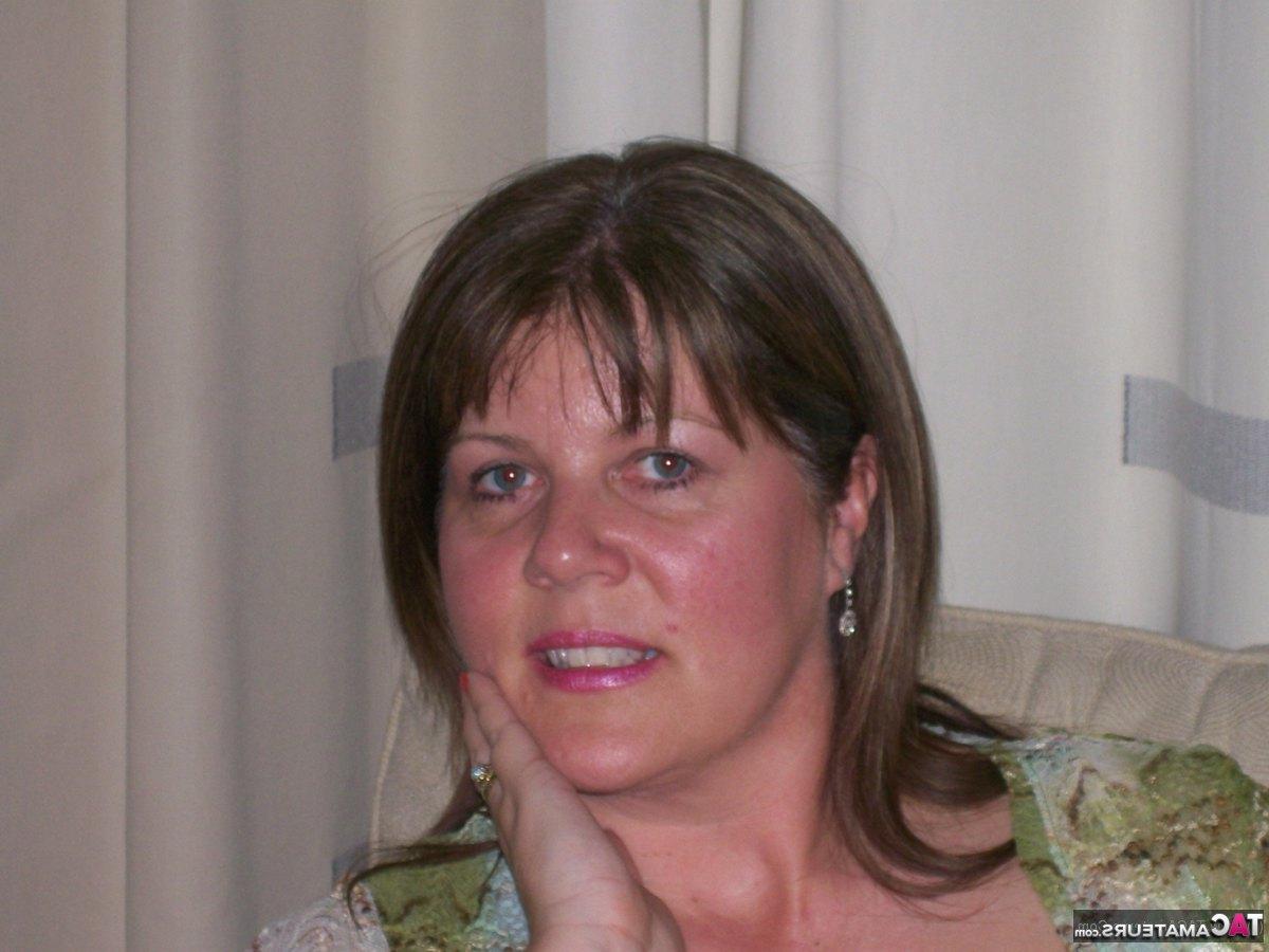 16P Mature lady Cassandra Uk slides her panties aside after showing her nipples