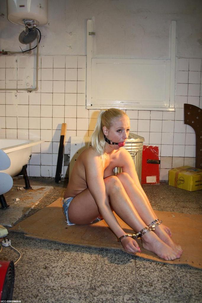 16P Helpless female is left alone with her wrists handcuffed to her ankles