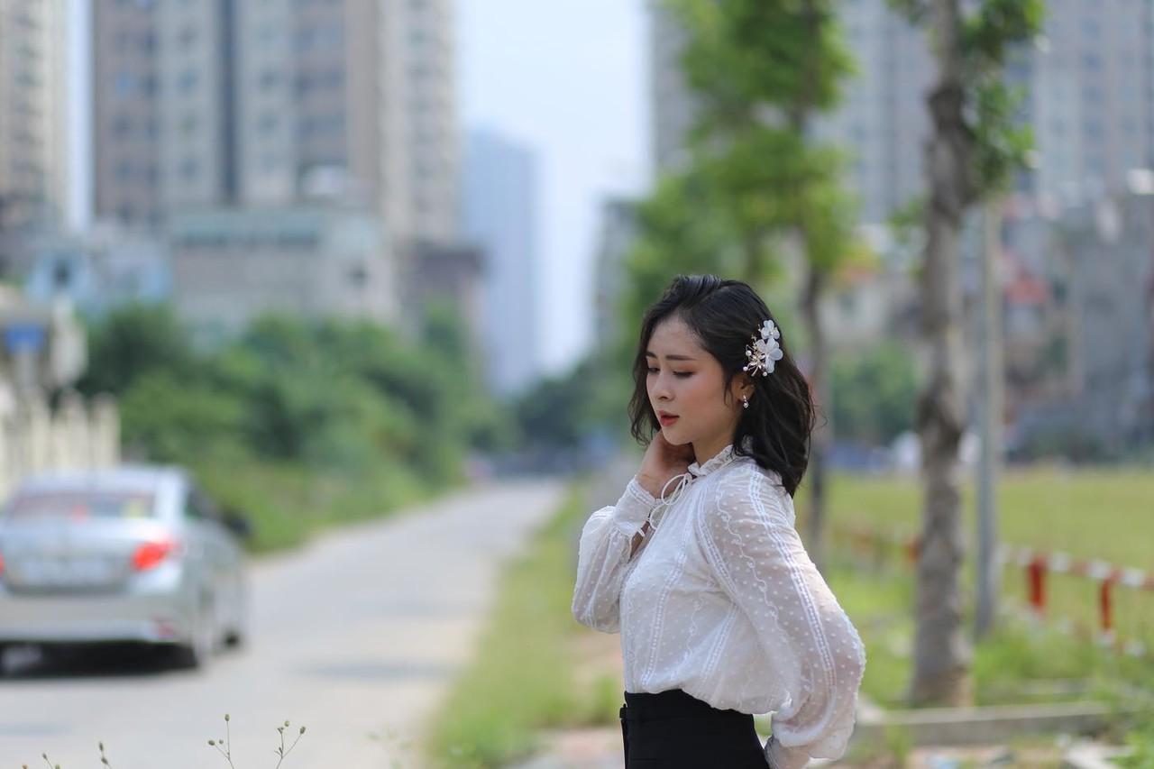 20P Dark-haired Asian babe Rosy Nhatle posing in her elegant outfit in public