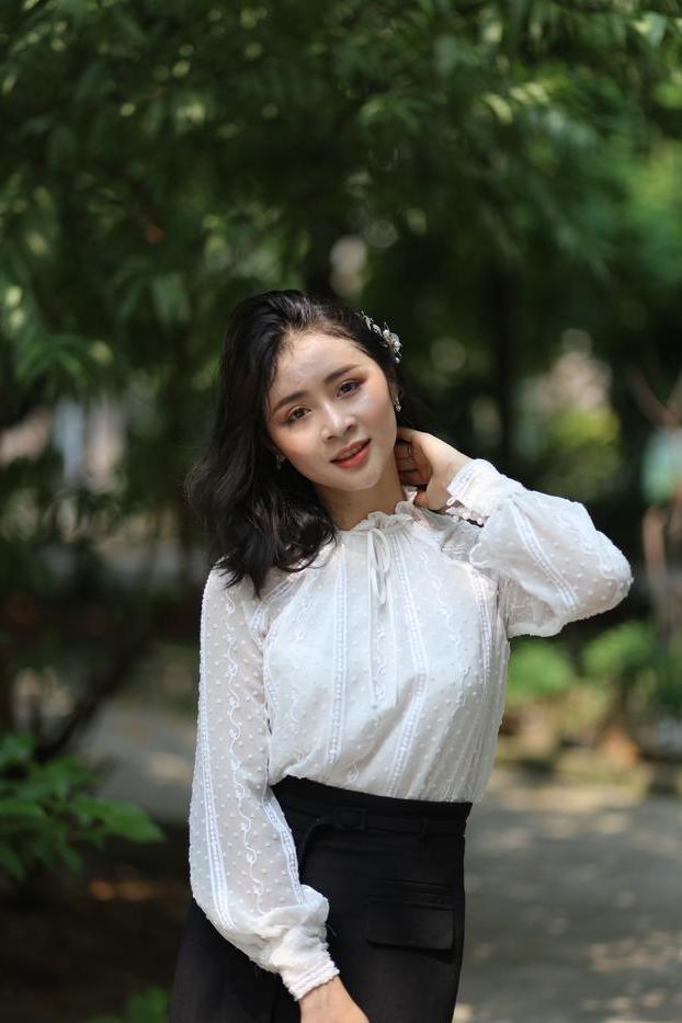 20P Dark-haired Asian babe Rosy Nhatle posing in her elegant outfit in public