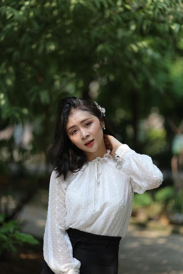 20P Dark-haired Asian babe Rosy Nhatle posing in her elegant outfit in public