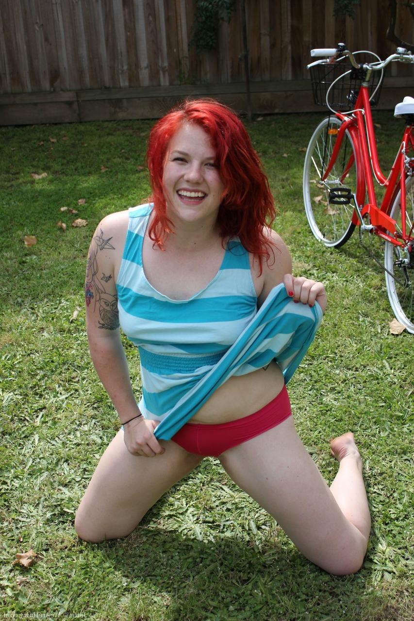 19P Inked ginger Jette strips naked and does exercise while showing off bushy cunt